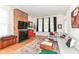 Bright living room with fireplace, large windows, comfortable grey sofa, and stylish decor at 1630 N New Jersey St, Indianapolis, IN 46202