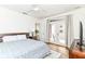 Serene main bedroom with hardwood flooring, ceiling fan, and access to a private balcony at 1630 N New Jersey St, Indianapolis, IN 46202