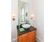 Elegant powder room with stylish vanity, vessel sink, modern fixtures, and decorative lighting at 1630 N New Jersey St, Indianapolis, IN 46202
