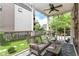 Relaxing screened-in porch with wicker furniture, ceiling fan and view of the backyard at 1630 N New Jersey St, Indianapolis, IN 46202