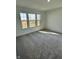 Neutral bedroom with gray carpet, white walls, trim, and a bright window at 1679 W 171St St, Westfield, IN 46074