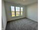New bedroom with gray carpet, neutral walls and a large window offering natural light and street view at 1679 W 171St St, Westfield, IN 46074