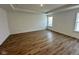 This bedroom offers ample natural light, hardwood floors, and neutral decor at 1679 W 171St St, Westfield, IN 46074