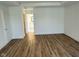 Bedroom features hardwood floors and a view into the bathroom at 1679 W 171St St, Westfield, IN 46074