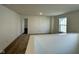 Spacious bedroom features neutral carpeting, a window, and an open doorway at 1679 W 171St St, Westfield, IN 46074