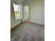 Bright, neutral bedroom with gray carpet, white walls, trim, and a bright window at 1679 W 171St St, Westfield, IN 46074