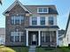 Charming new construction two-story home with a brick and siding facade and welcoming front porch at 1679 W 171St St, Westfield, IN 46074