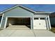 Attached two-car garage with blue siding, white doors, and an open bay for convenient parking at 1679 W 171St St, Westfield, IN 46074
