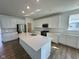 Spacious kitchen with island, quartz countertops, stainless steel appliances, and ample cabinet space at 1679 W 171St St, Westfield, IN 46074