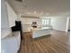 Bright, modern kitchen features white cabinets, a large island and stainless steel appliances at 1679 W 171St St, Westfield, IN 46074