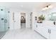 Bright bathroom with a glass enclosed shower, double vanity, and marble flooring at 175 Rock Island Rd, Westfield, IN 46074