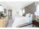 Comfortable bedroom with neutral tones, a gray accent wall, and ample natural light at 175 Rock Island Rd, Westfield, IN 46074