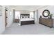 Spacious primary bedroom with tray ceiling, two windows, a dresser, and an ensuite at 175 Rock Island Rd, Westfield, IN 46074