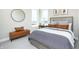 Comfortable bedroom with large window, round mirror, leather bench, and neutral decor at 175 Rock Island Rd, Westfield, IN 46074
