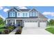Charming two-story home with a stone facade, a two-car garage, and beautifully landscaped front yard at 175 Rock Island Rd, Westfield, IN 46074