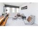 Inviting game room with a brick wall, stylish seating, and a desk area with natural light at 175 Rock Island Rd, Westfield, IN 46074