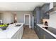 Spacious kitchen with stainless steel appliances, gray cabinets, quartz countertops, and an eat-in island at 175 Rock Island Rd, Westfield, IN 46074
