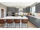 Contemporary kitchen featuring gray cabinetry, quartz counters, subway tile backsplash, and an island with seating at 175 Rock Island Rd, Westfield, IN 46074