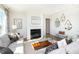 Cozy living room with fireplace, comfortable sofa, and decorative mirrors creating a welcoming space at 175 Rock Island Rd, Westfield, IN 46074