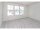 Bright bedroom with large windows and neutral carpet, providing a serene and inviting space at 18943 Seaforth Way, Westfield, IN 46074