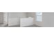 Second floor hallway with gray carpet, white walls, natural light, and a white banister at 18943 Seaforth Way, Westfield, IN 46074