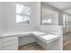 Bright home office features a built-in desk, storage drawers, and natural light from a window at 18943 Seaforth Way, Westfield, IN 46074