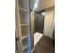 Shower featuring dark tiled wall and open shelves perfect for storage in this modern bathroom at 2009 Draper St, Indianapolis, IN 46203