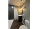 Bathroom features a modern sink and vanity, toilet, and stylish black tiled shower at 2009 Draper St, Indianapolis, IN 46203