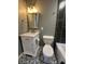 Updated bathroom featuring a stylish vanity and modern fixtures, complemented by contemporary tile flooring at 2009 Draper St, Indianapolis, IN 46203