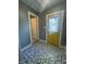 Hallway with yellow door and modern tile flooring at 2009 Draper St, Indianapolis, IN 46203