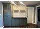 Well-organized kitchen with olive green cabinets, subway tile backsplash and dark countertop at 2009 Draper St, Indianapolis, IN 46203
