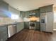 Contemporary kitchen with stainless steel appliances, custom cabinets, and a stylish backsplash at 2009 Draper St, Indianapolis, IN 46203