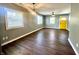 Spacious living area with hardwood floors, large windows, and modern lighting fixtures at 2009 Draper St, Indianapolis, IN 46203