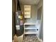 The utility room features a water heater, shelving for storage, and a modern tile floor at 2009 Draper St, Indianapolis, IN 46203