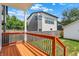 A wood deck with iron railings overlooks the backyard of this home at 2013 Yandes St, Indianapolis, IN 46202