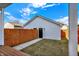Backyard features a wood privacy fence, a well manicured lawn, and a detached garage at 2013 Yandes St, Indianapolis, IN 46202