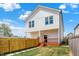 The backyard has a privacy fence, a wood deck, and a stepping stone path at 2013 Yandes St, Indianapolis, IN 46202