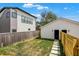 A backyard with a stepping stone path leading to a detached garage is shown at 2013 Yandes St, Indianapolis, IN 46202