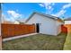 Backyard features a wood privacy fence, a well manicured lawn, and a detached garage at 2013 Yandes St, Indianapolis, IN 46202