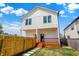 The backyard features a privacy fence, wood deck, and stepping stone path at 2013 Yandes St, Indianapolis, IN 46202
