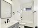 Stylish bathroom features a sleek vanity with modern fixtures and a tiled shower-tub combo at 2013 Yandes St, Indianapolis, IN 46202