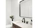 Modern powder room features a sleek mirror, decorative vanity, and a minimalist design at 2013 Yandes St, Indianapolis, IN 46202
