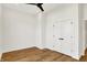 Bright bedroom features hardwood floors, ceiling fan, and a double door closet for ample storage at 2013 Yandes St, Indianapolis, IN 46202