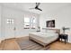 Bright bedroom with hardwood floors, large windows, and modern decor at 2013 Yandes St, Indianapolis, IN 46202
