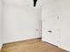 Minimalist bedroom featuring light hardwood floors, a ceiling fan, and ample closet space at 2013 Yandes St, Indianapolis, IN 46202