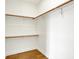 Walk-in closet with wood floors and ample storage at 2013 Yandes St, Indianapolis, IN 46202