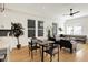 Open-concept dining area adjacent to the living room, featuring a modern table setting and lots of natural light at 2013 Yandes St, Indianapolis, IN 46202