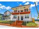 Inviting two-story duplex with a cozy shared porch and well-maintained lawn at 2013 Yandes St, Indianapolis, IN 46202
