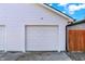 Close up of white garage door and siding at 2013 Yandes St, Indianapolis, IN 46202