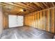 Exposed wood studs and concrete floor offer a blank canvas in this new garage at 2013 Yandes St, Indianapolis, IN 46202